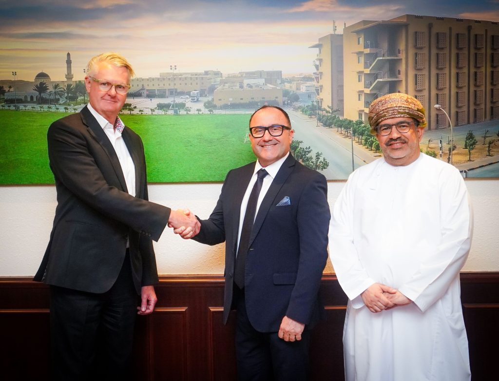 (standing from left to right): Andrew Dawson, CEO, Renaissance Services; Erwan Harb, Managing Director, Socat; and Juma Al Khamisi, CFO, Renaissance Services